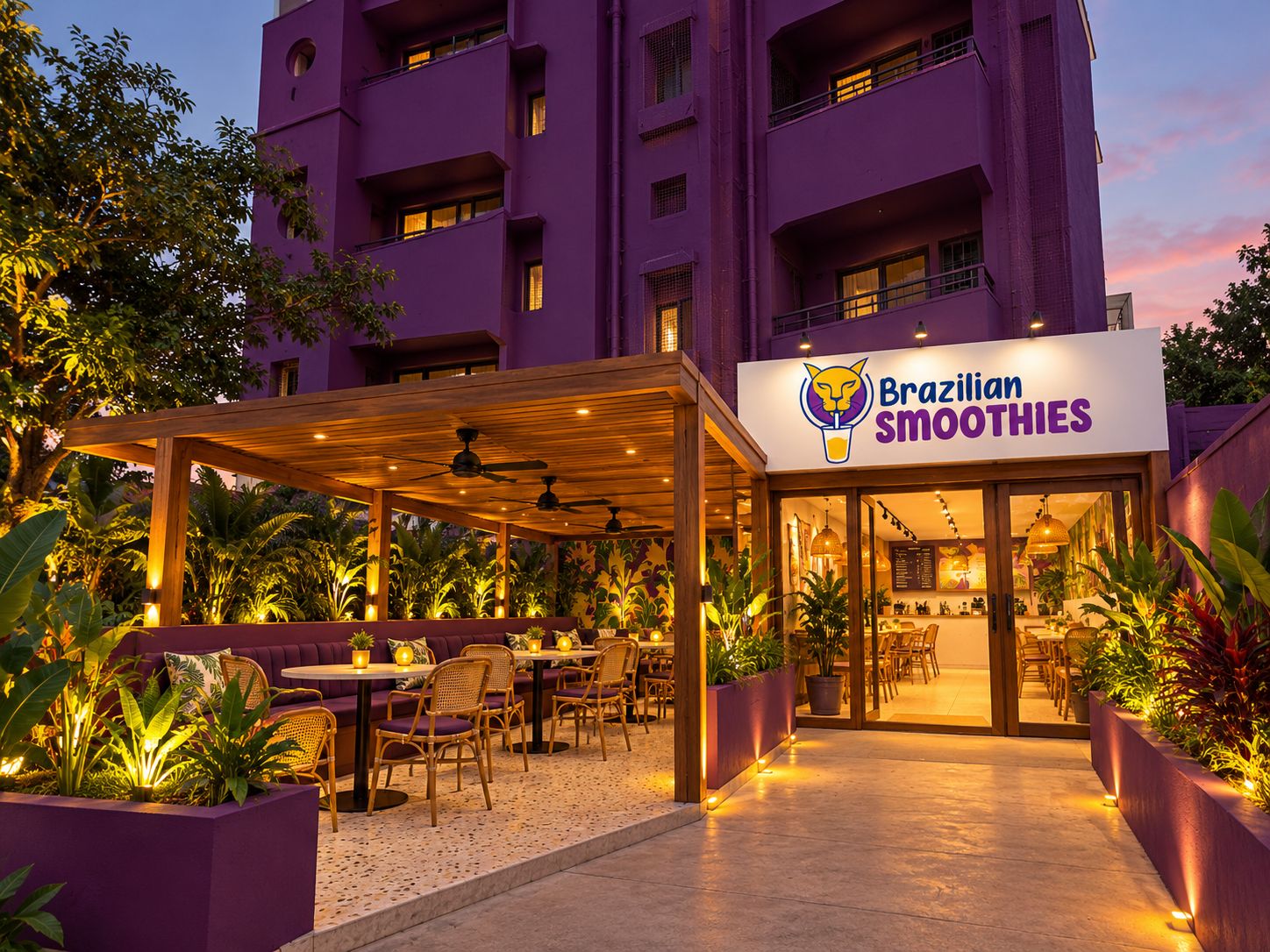 Brazilian Smoothies flagship at dusk, a purple building with a lit pergola and garden seating